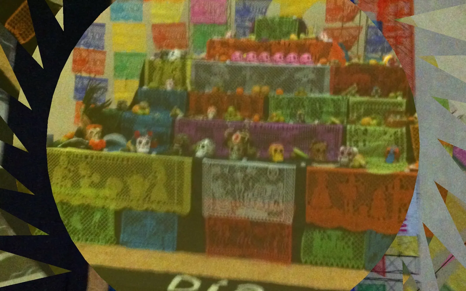 A Day of the Dead altar with traditional offerings, flowers, and candles arranged to honor and remember loved ones.